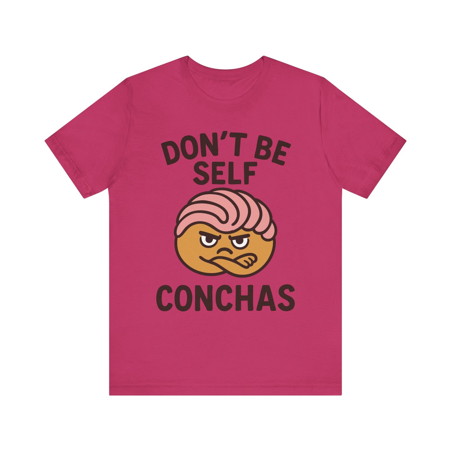 Fuchsia/Berry t-shirt with ‘Don’t Be Self Conchas’ text and a pink concha pastry graphic in the center