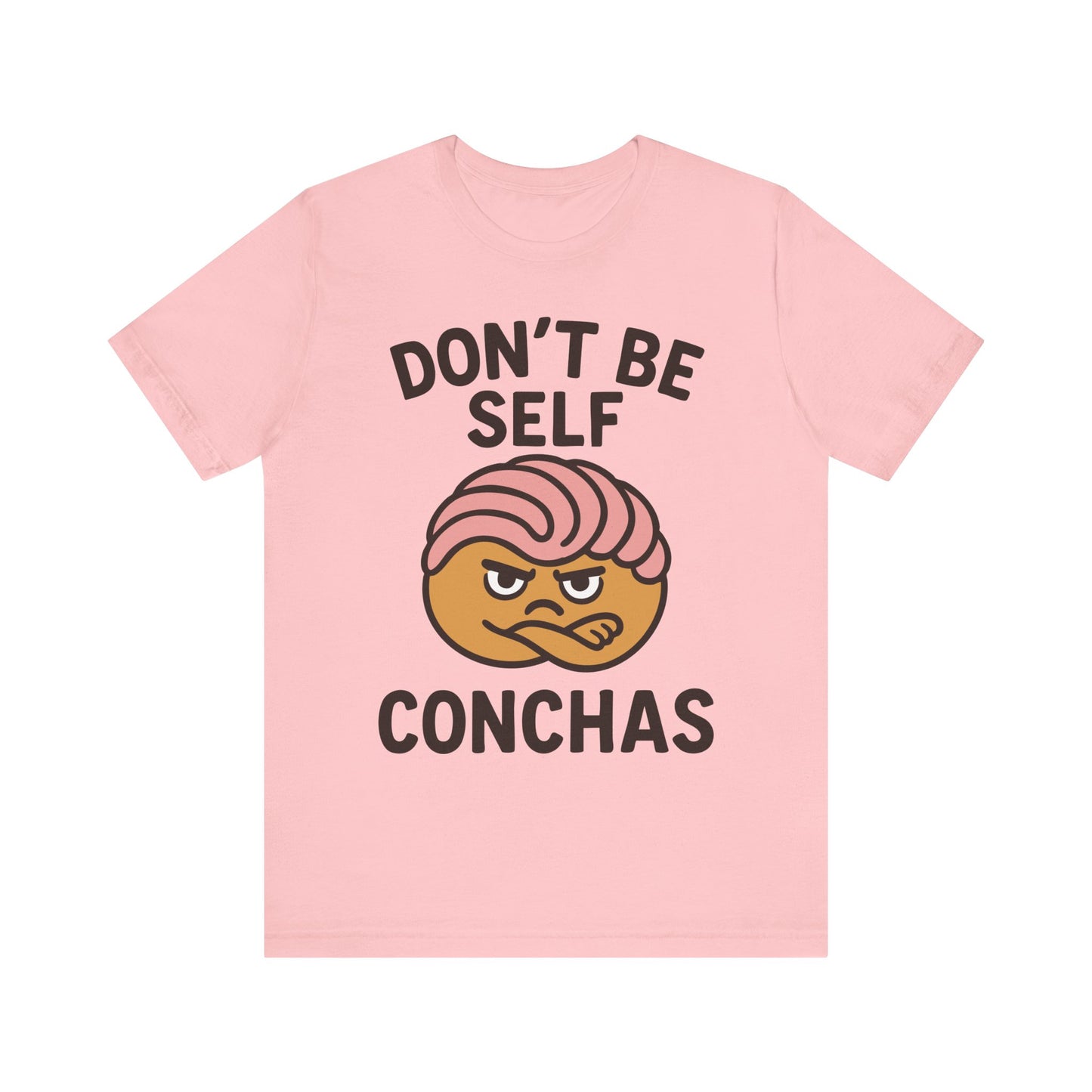 Light pink t-shirt with ‘Don’t Be Self Conchas’ text and a pink concha pastry graphic in the center
