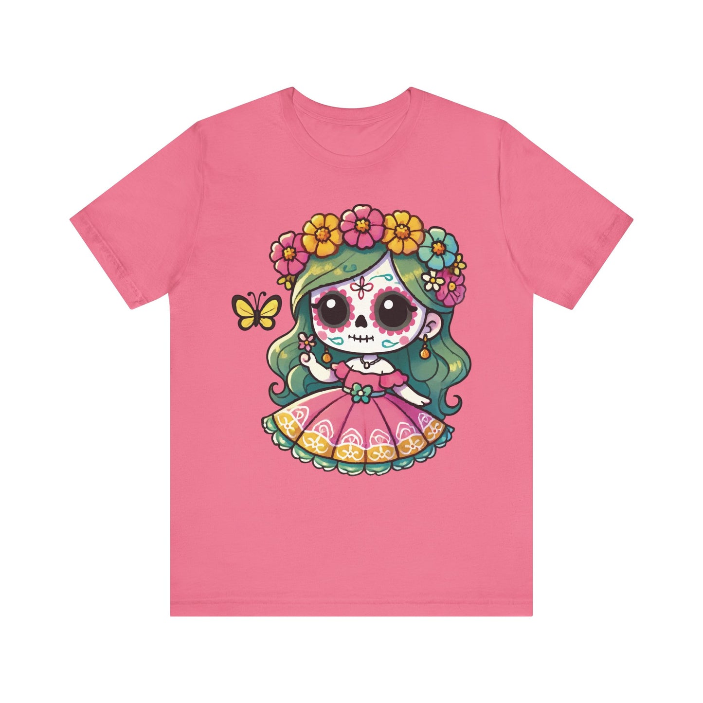 Charity pink t-shirt with adorable chibi sugar skull girl, green hair, pink folk dress, colorful flower crown, and butterfly — perfect for Dia de los Muertos style.