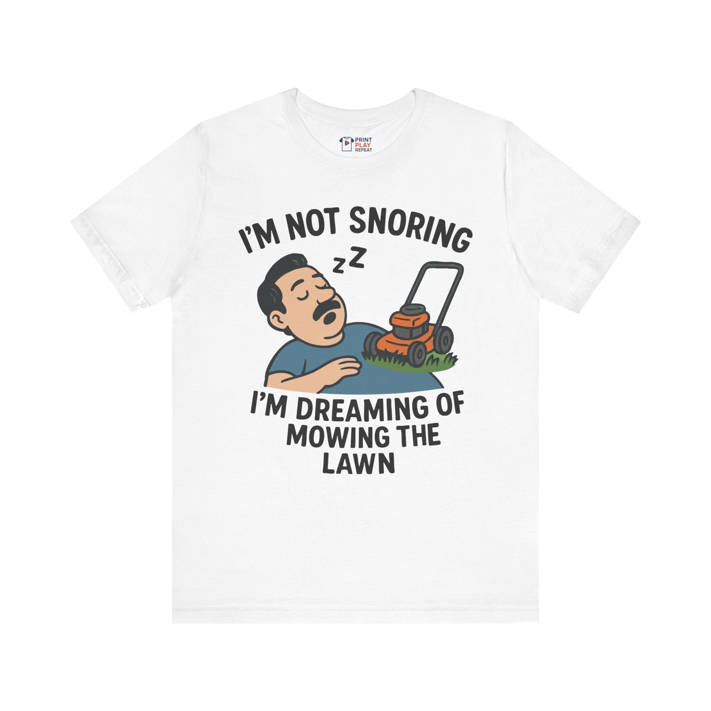 White t-shirt with a funny sleeping man cartoon and the phrase "I'm not snoring, I'm dreaming of mowing the lawn" in bold black text.
