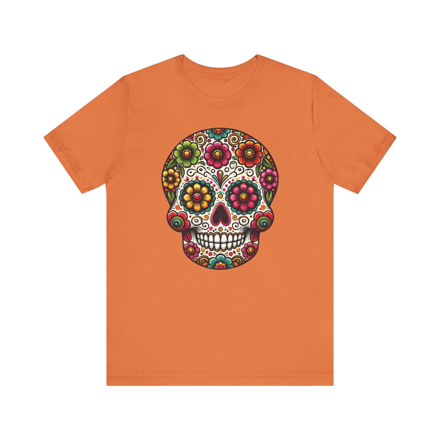 Burnt orange t-shirt with a festive floral sugar skull in vivid pinks, greens, blues, and oranges inspired by Day of the Dead art.