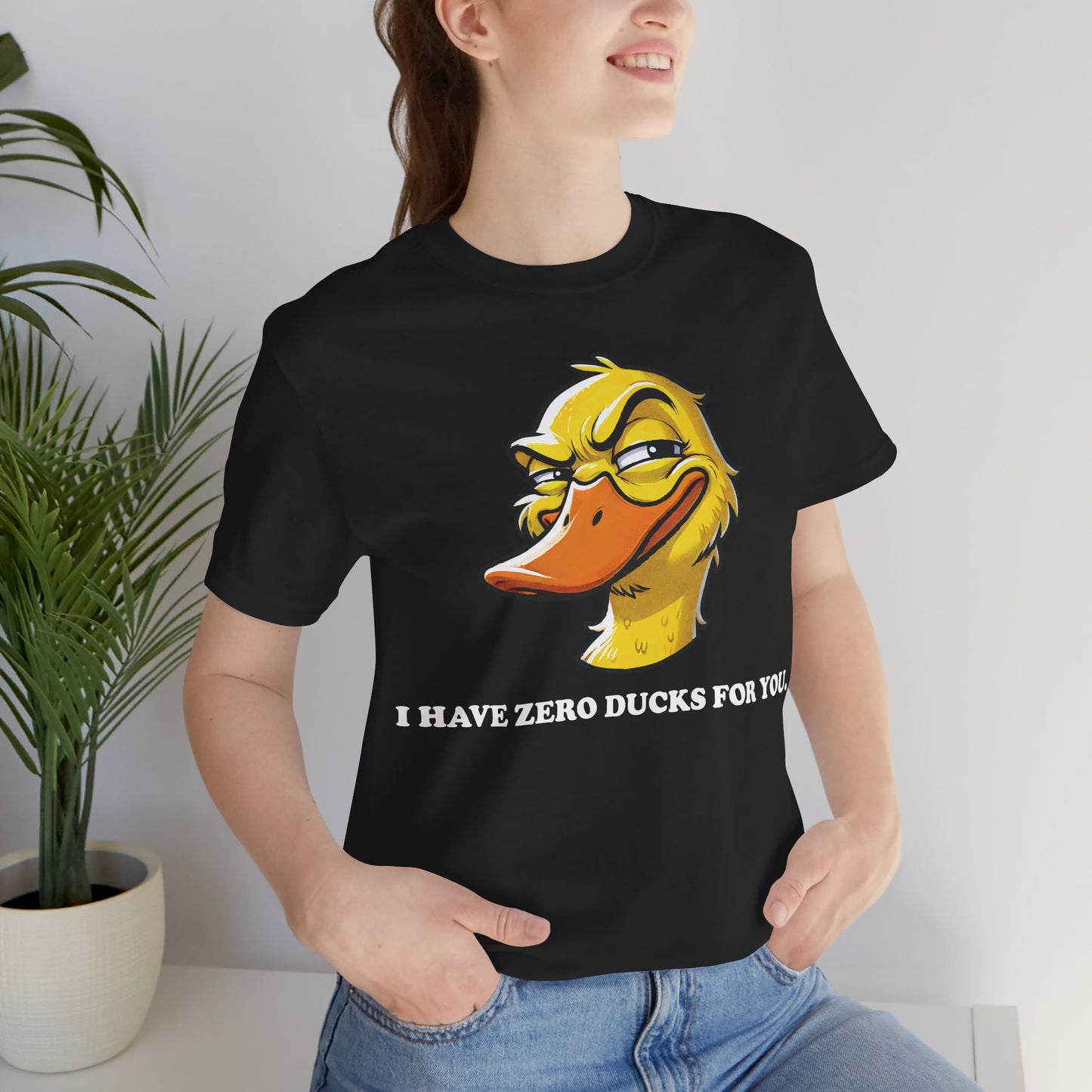 Black t-shirt with a smirking cartoon duck face and the bold text "I HAVE ZERO DUCKS FOR YOU." in white lettering.
