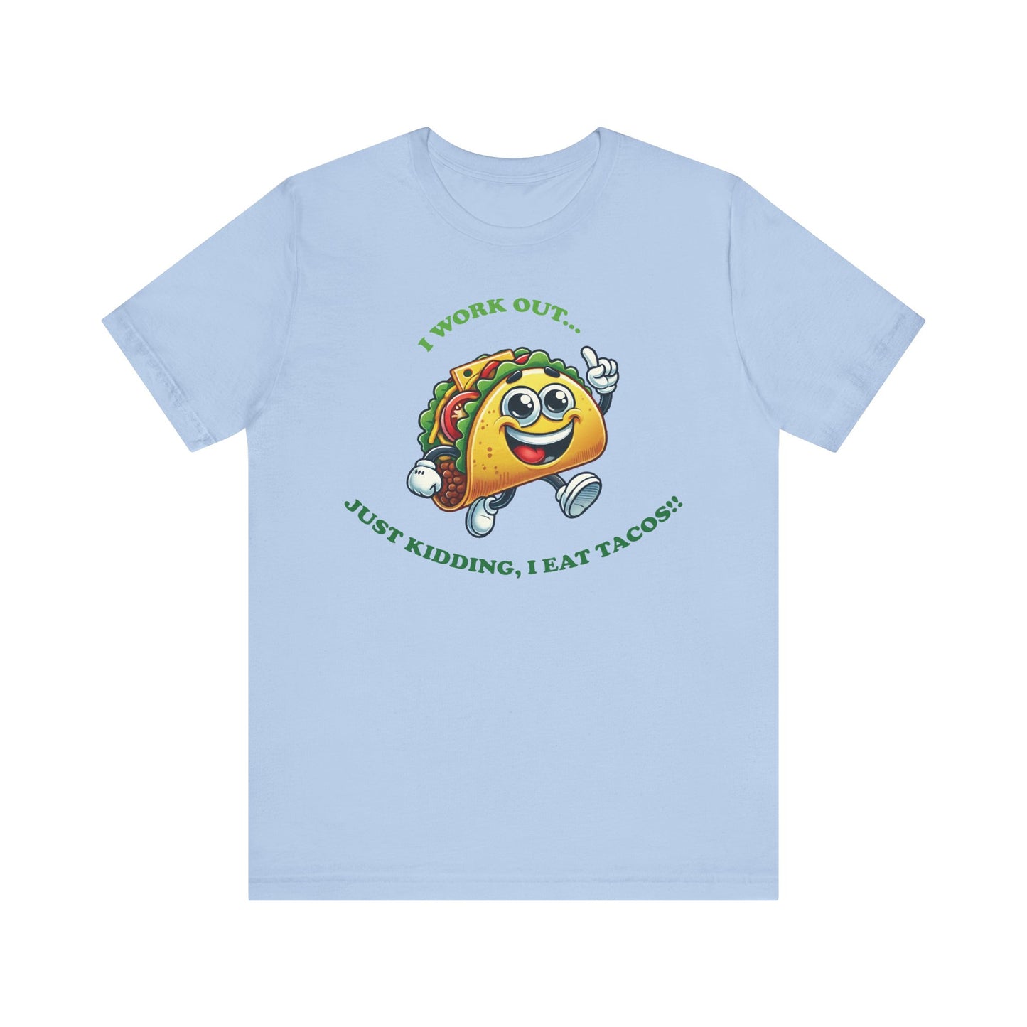 Baby blue t-shirt featuring a smiling cartoon taco in sneakers with the phrase "I WORK OUT... JUST KIDDING, I EAT TACOS!!" in green text.