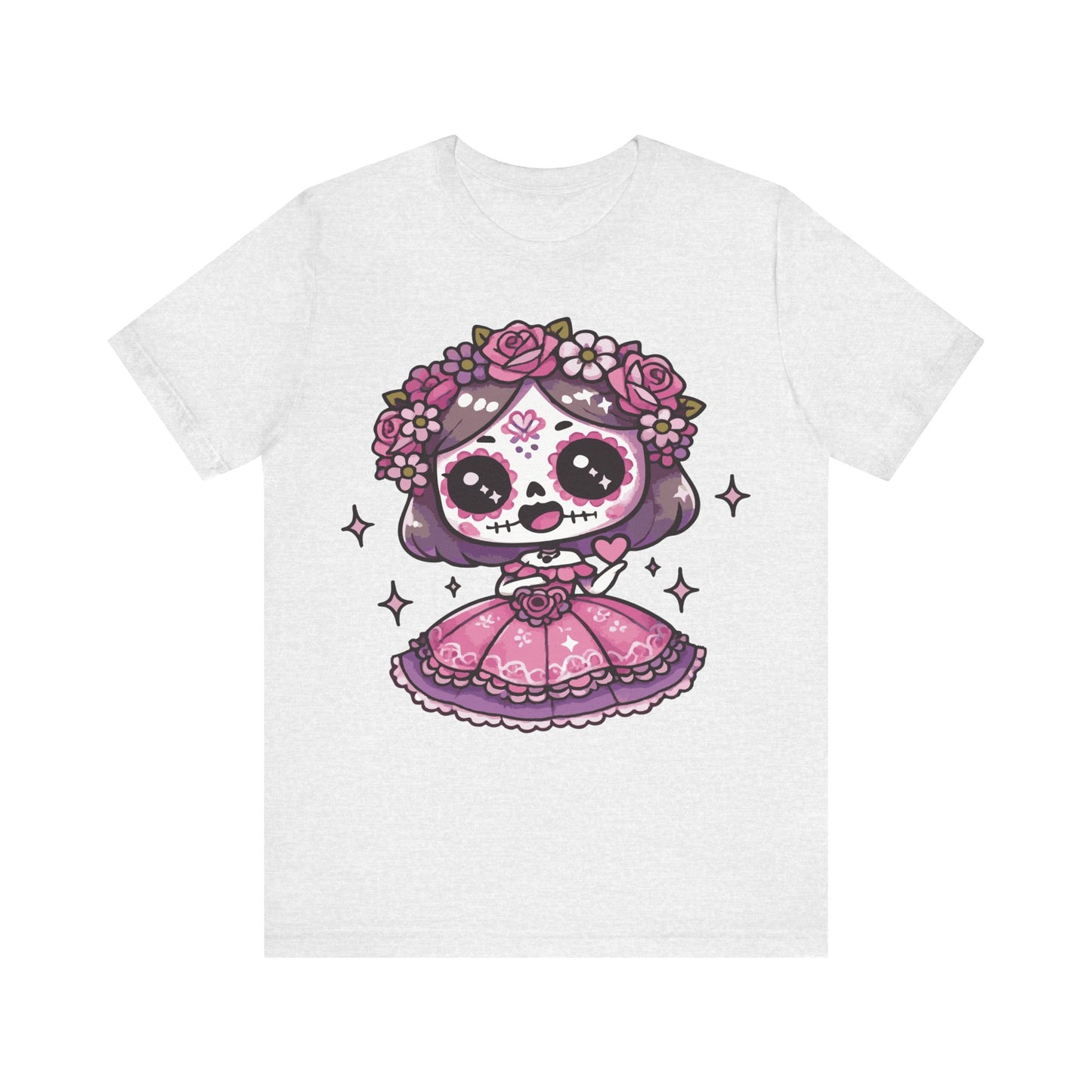 Ash color t-shirt featuring a kawaii chibi sugar skull girl with purple hair, pink sugar skull face paint, floral crown of roses, and a pink Mexican folk dress with sparkles.