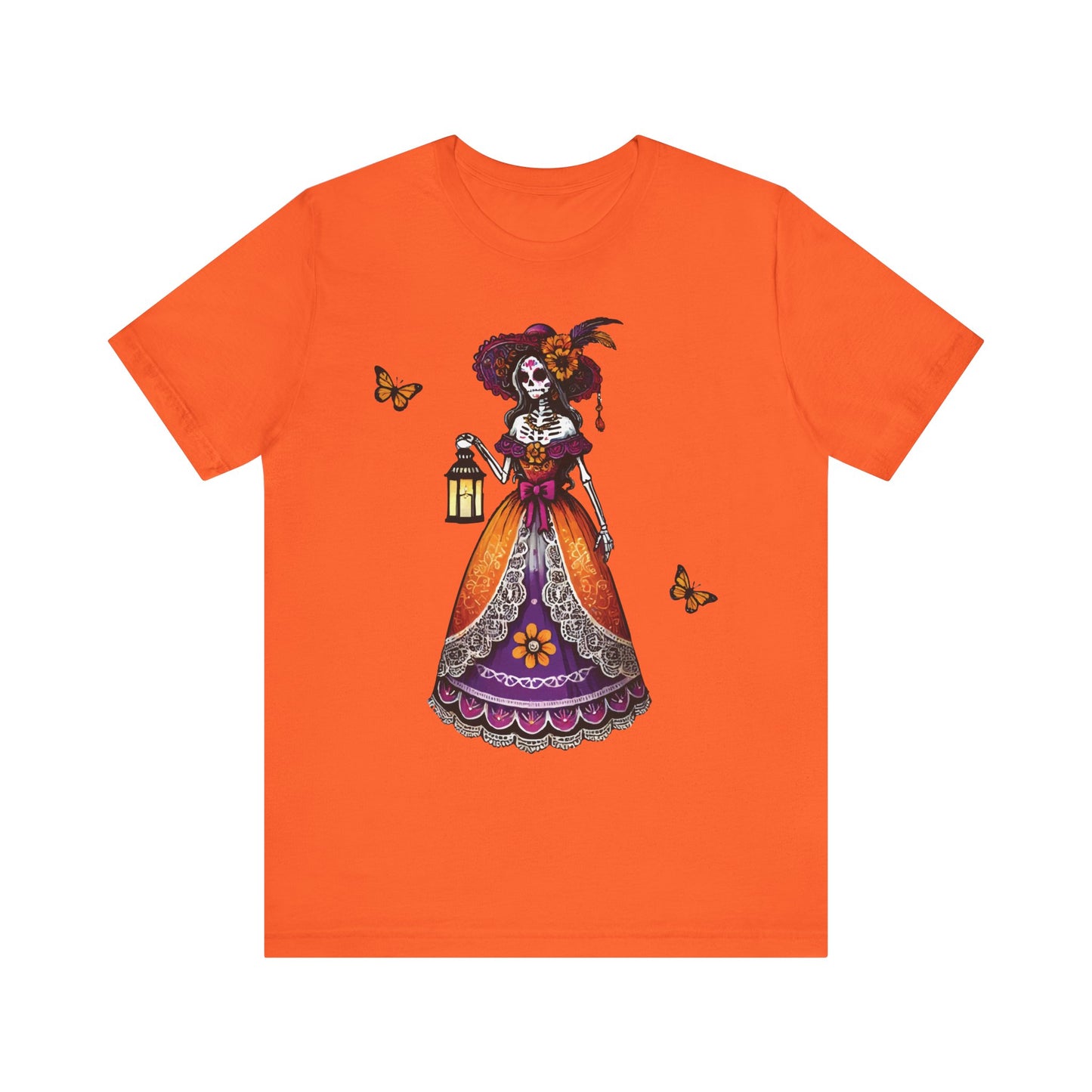 Heather orange t-shirt with a bold Día de los Muertos design of La Catrina skeleton lady holding a lantern, surrounded by monarch butterflies and wearing a colorful dress.