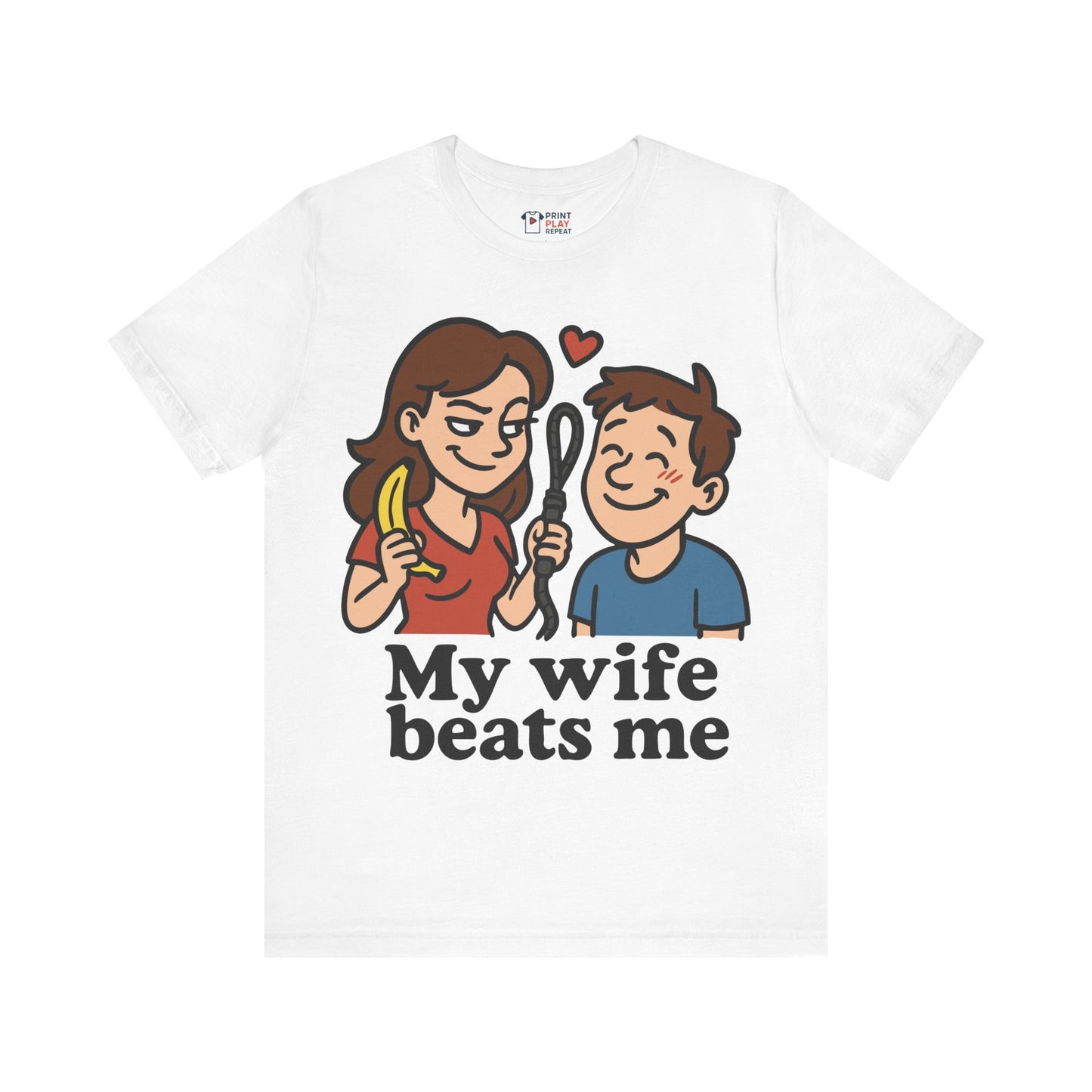 White t-shirt featuring funny cartoon design with a wife holding a banana and whisk, and the quote "My Wife Beats Me".
