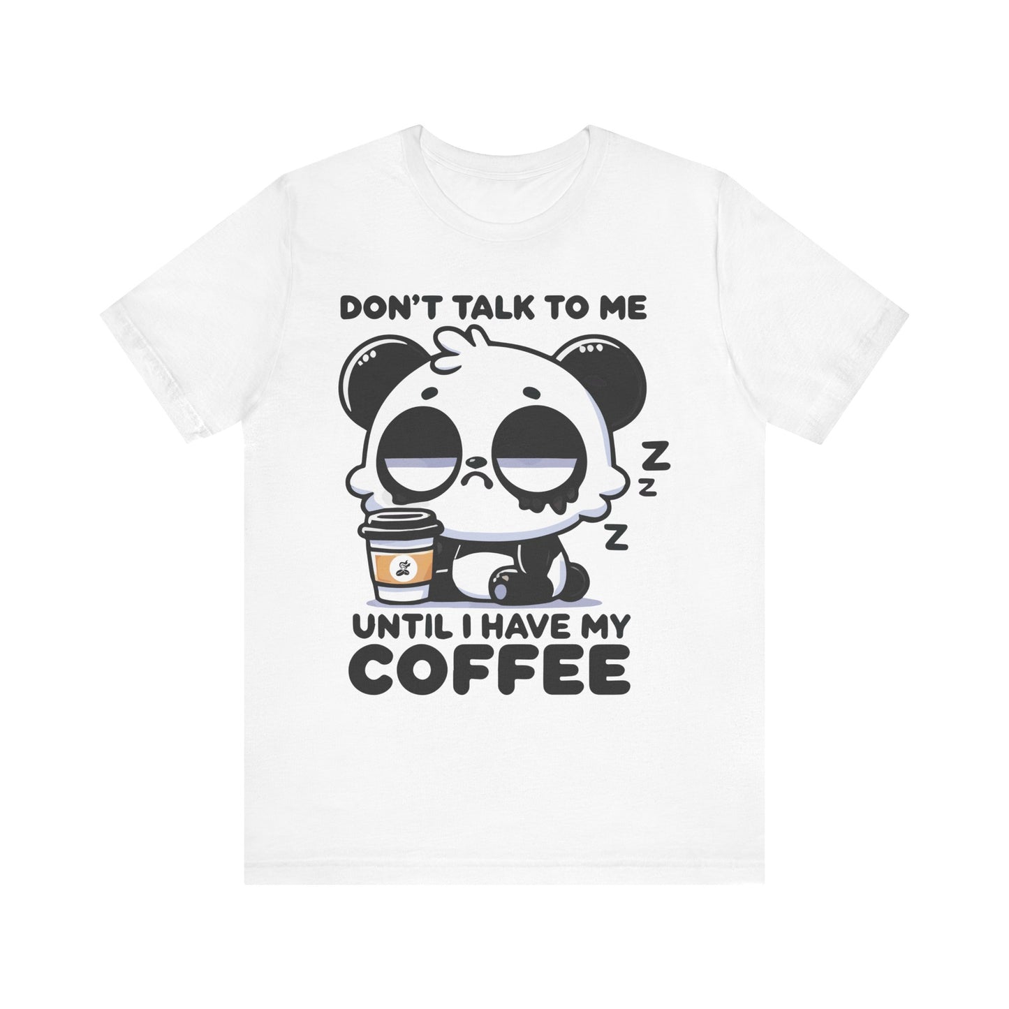 White t-shirt with a sleepy panda holding coffee and the quote "Don’t Talk to Me Until I Have My Coffee"

