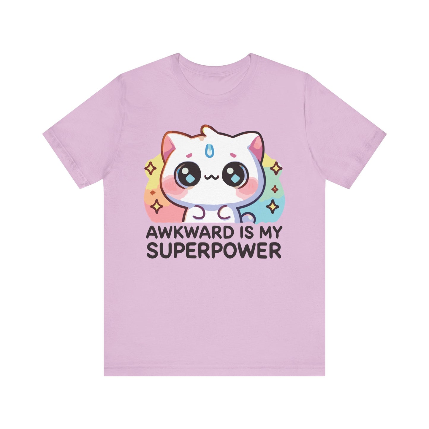 Lilac t-shirt featuring a pastel rainbow cat and the phrase "Awkward Is My Superpower" in bold contrasting font.
