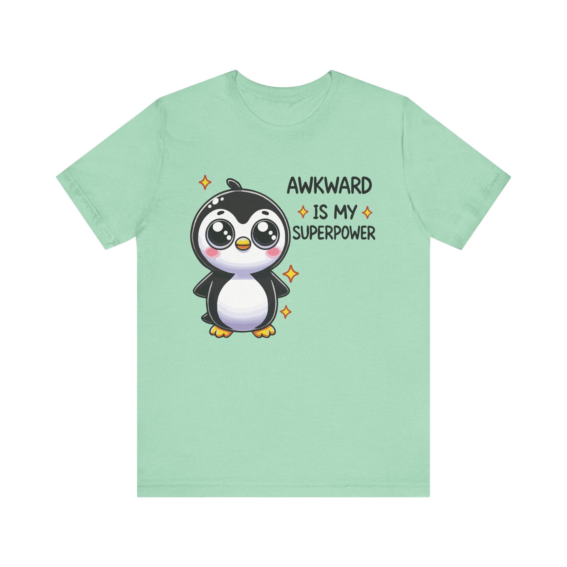 Heather mint t-shirt with a colorful penguin cartoon and the phrase "Awkward Is My Superpower" in a cute, sparkling style.
