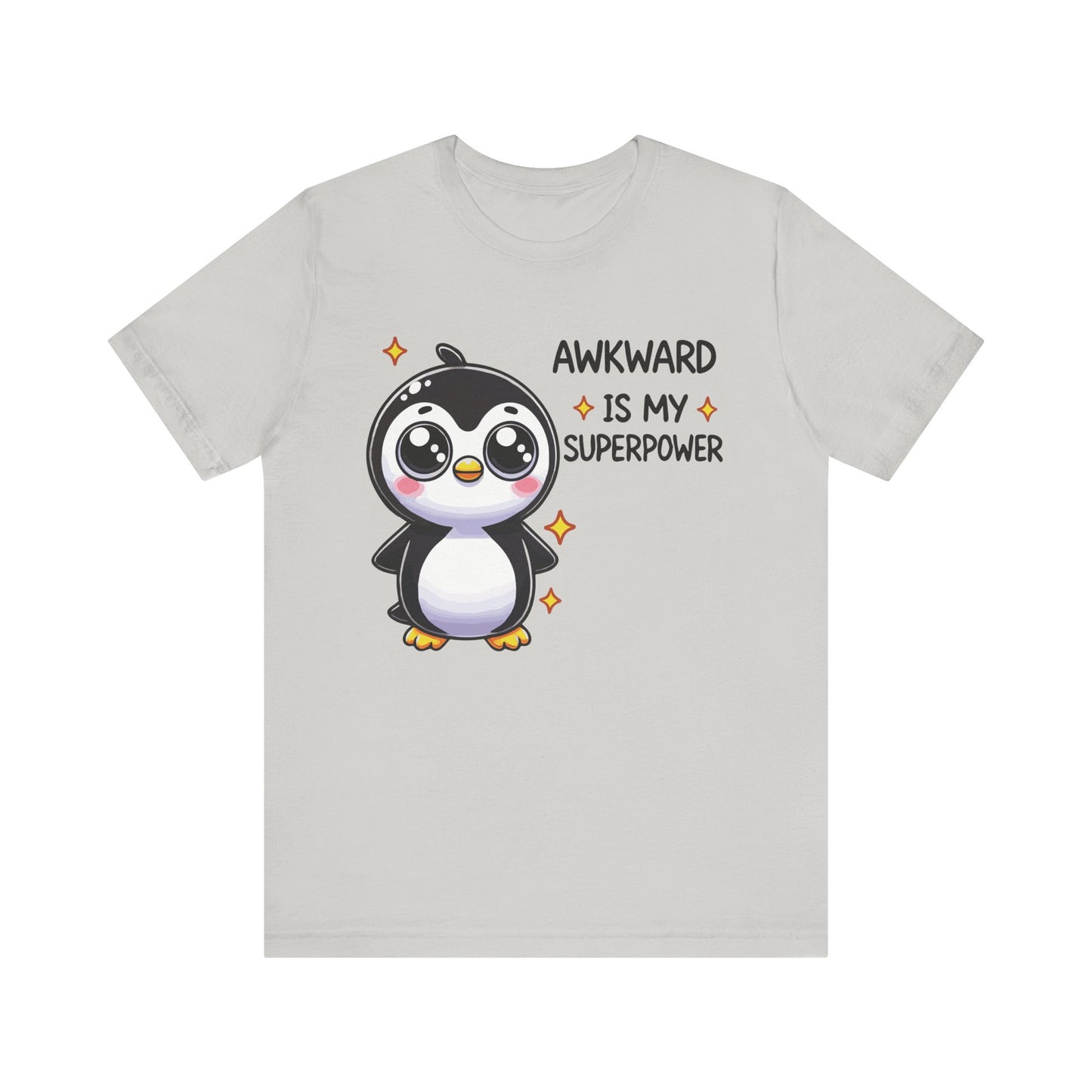 Silver t-shirt with a kawaii-style penguin surrounded by sparkles and the funny phrase "Awkward Is My Superpower."
