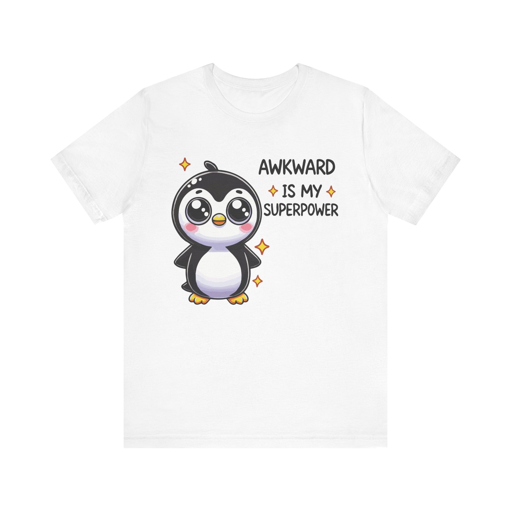 White t-shirt with a cute cartoon penguin and sparkles, featuring the text "Awkward Is My Superpower" in black and orange.
