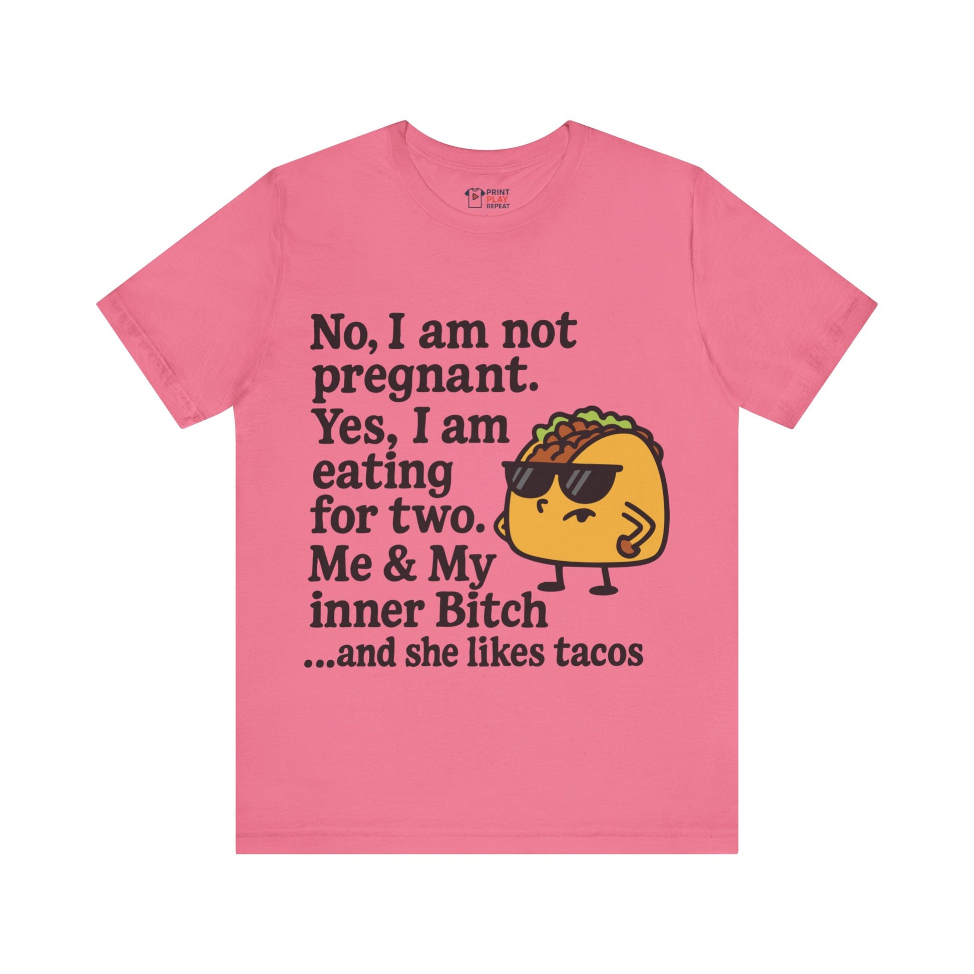 Charity pink t-shirt featuring edgy “eating for two” text and a quirky taco character.

