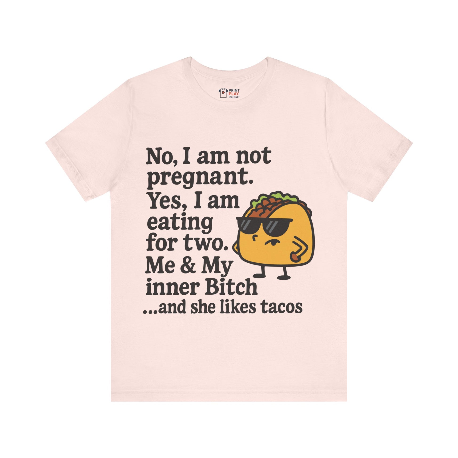 Pink t-shirt with bold foodie quote and a graphic taco character rocking sunglasses.
