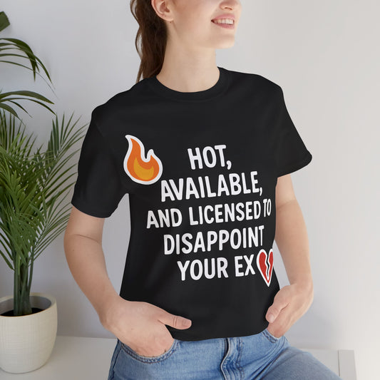 Black t-shirt worn by a woman featuring the bold text "Hot, Available, and Licensed to Disappoint Your Ex" with flame and broken heart emojis.

