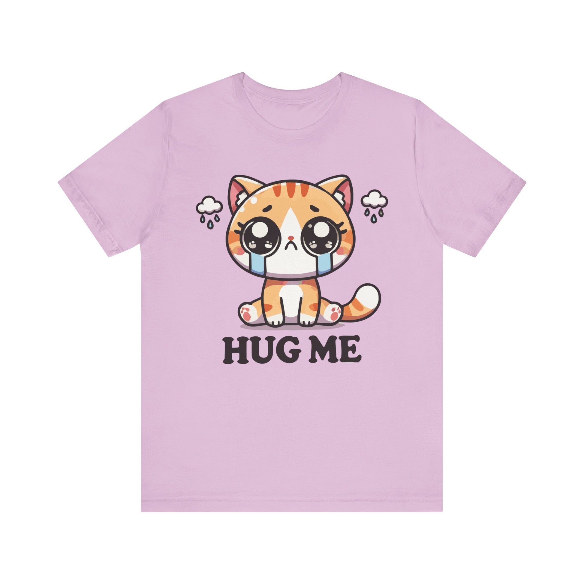 Lilac t-shirt showing a kawaii orange tabby with tears and rain clouds, above the playful text "Hug Me."
