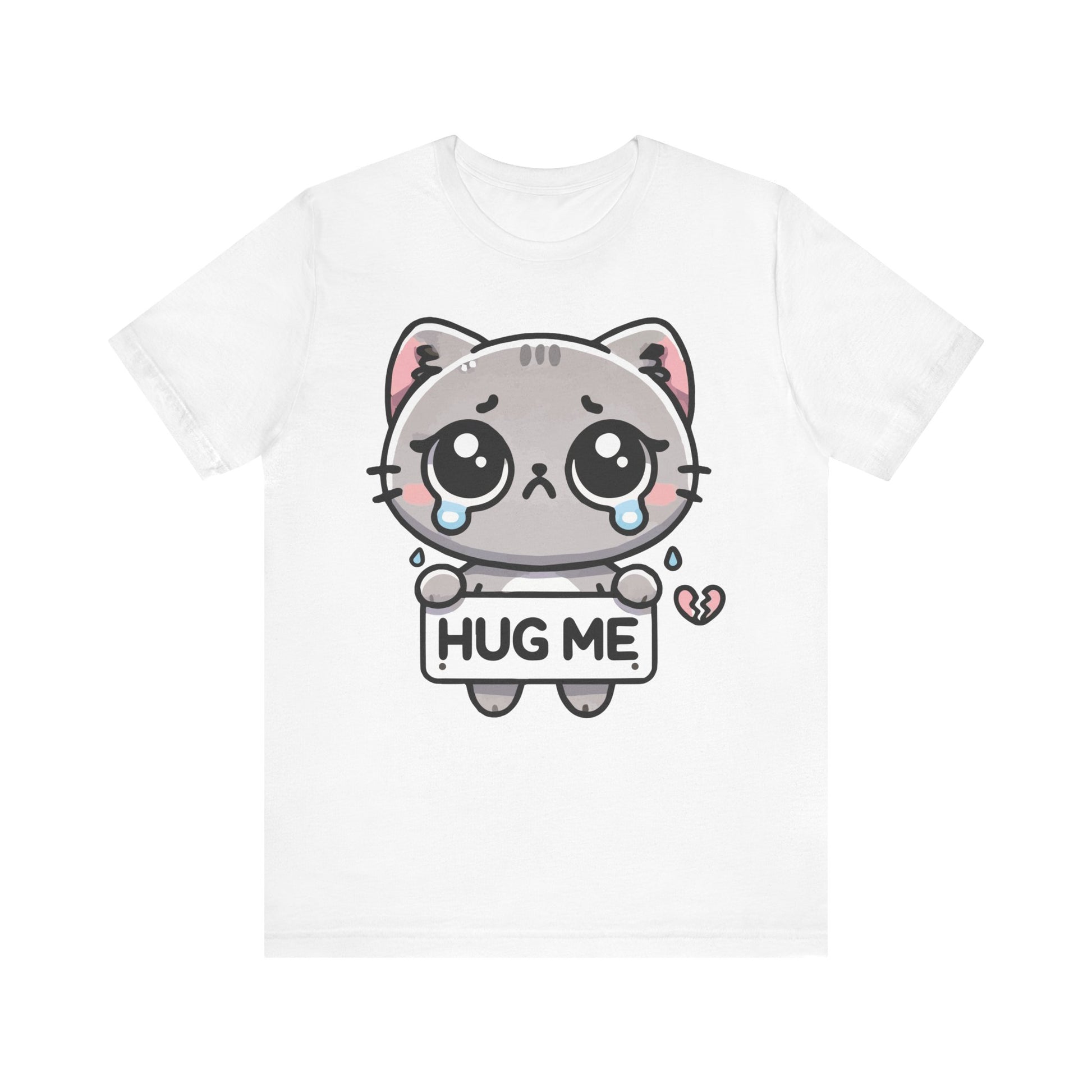 White t-shirt with a teary-eyed grey kawaii cat holding a "Hug Me" sign and a tiny broken heart graphic.
