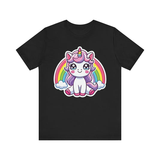 Black t-shirt featuring a kawaii pastel unicorn with big sparkling eyes, purple mane, rainbow horn, and sitting in front of a colorful rainbow with clouds.


