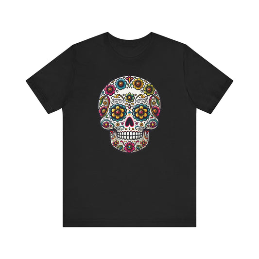 Black t-shirt with a traditional Mexican-style sugar skull decorated with colorful flowers, hearts, and swirls, inspired by Día de los Muertos.

