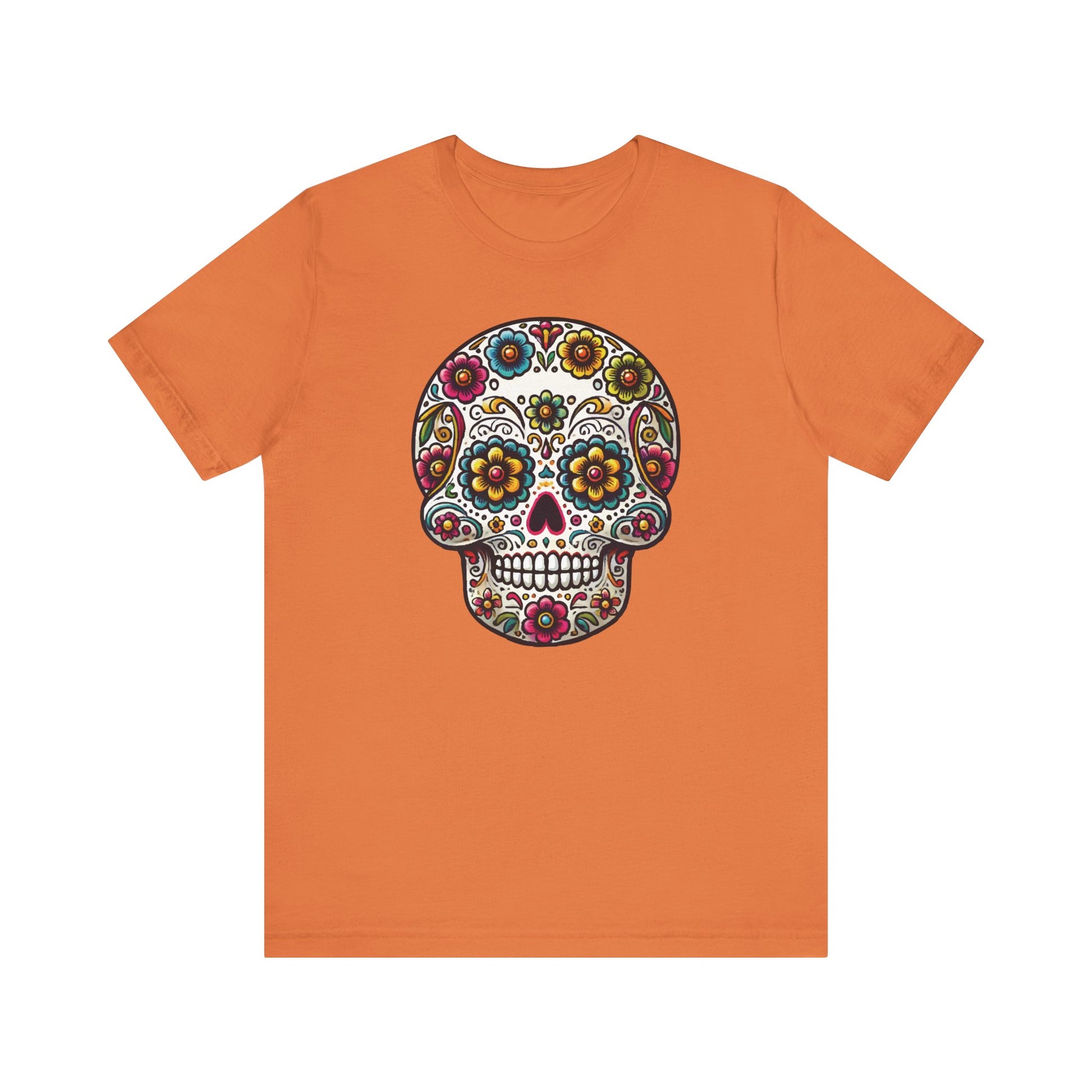 Burnt orange t-shirt with a bold floral sugar skull design filled with rich colors and intricate Mexican folk art patterns.
